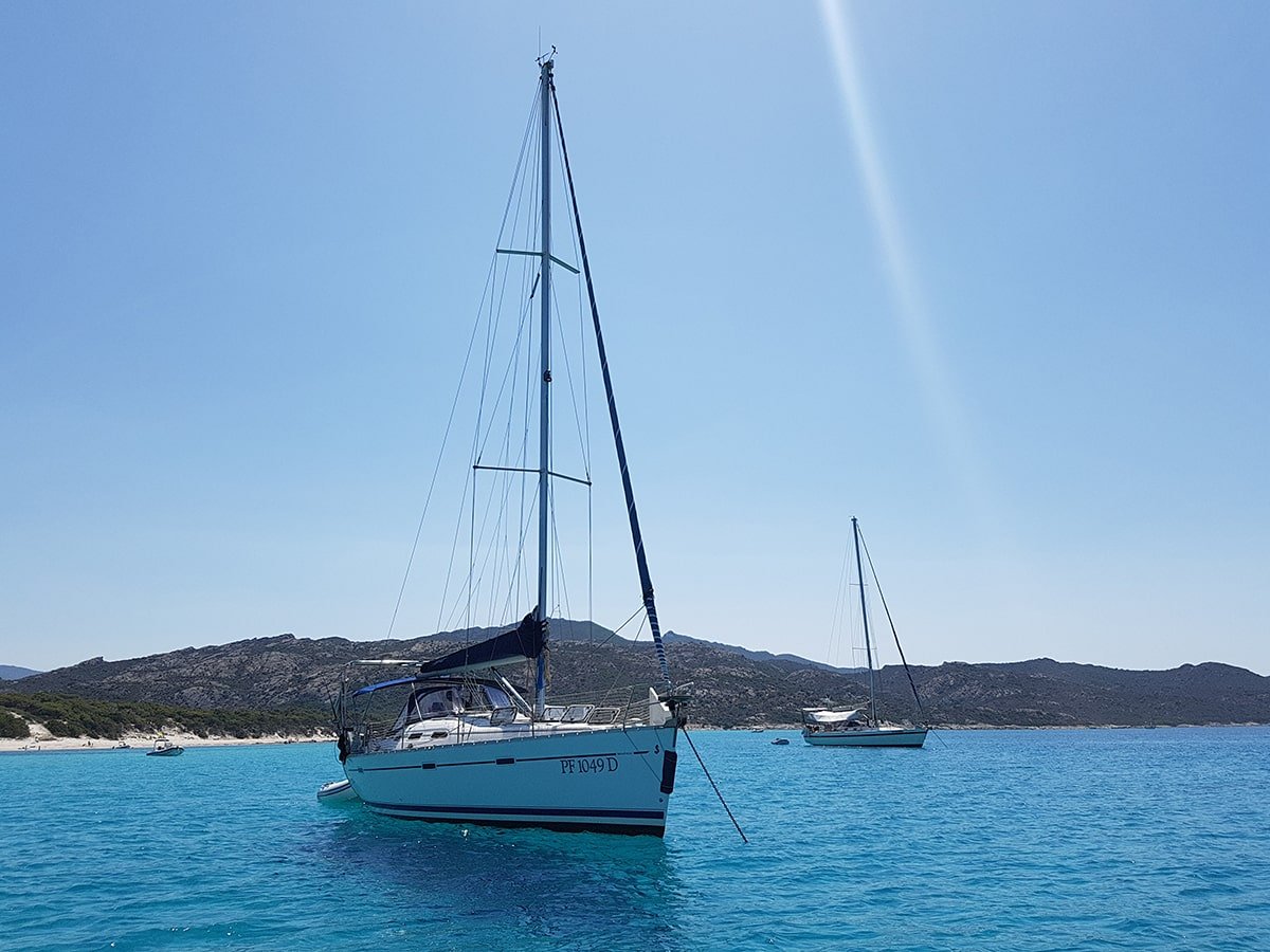 Boats on the turquoise water at Saleccia, Corsica