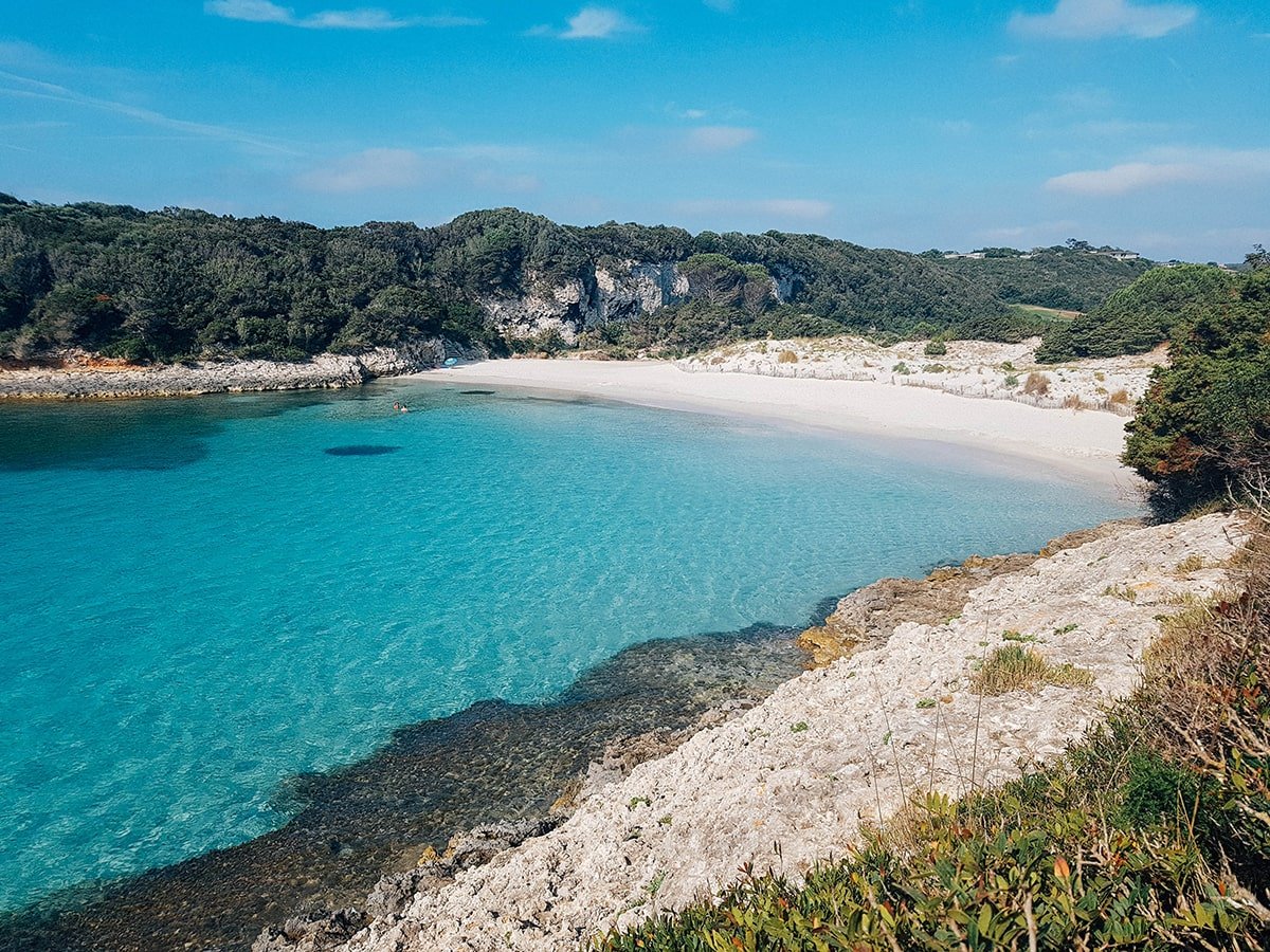 5 Stunning Corsican Beaches - Petit Sperone: A hidden gem with clear, shallow waters and a crescent-shaped beach framed by rocky cliffs.