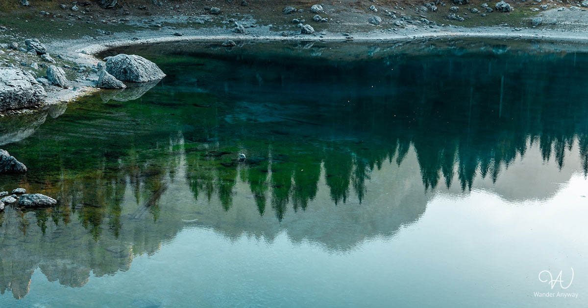 The bronze statue in lake Carezza