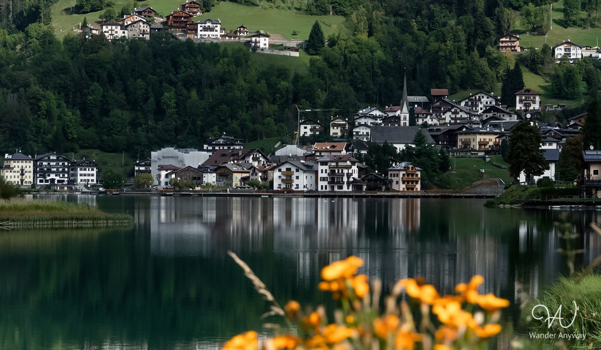 Nature's Reflections at Lake Alleghe: A visual delight in the heart of the Dolomites.