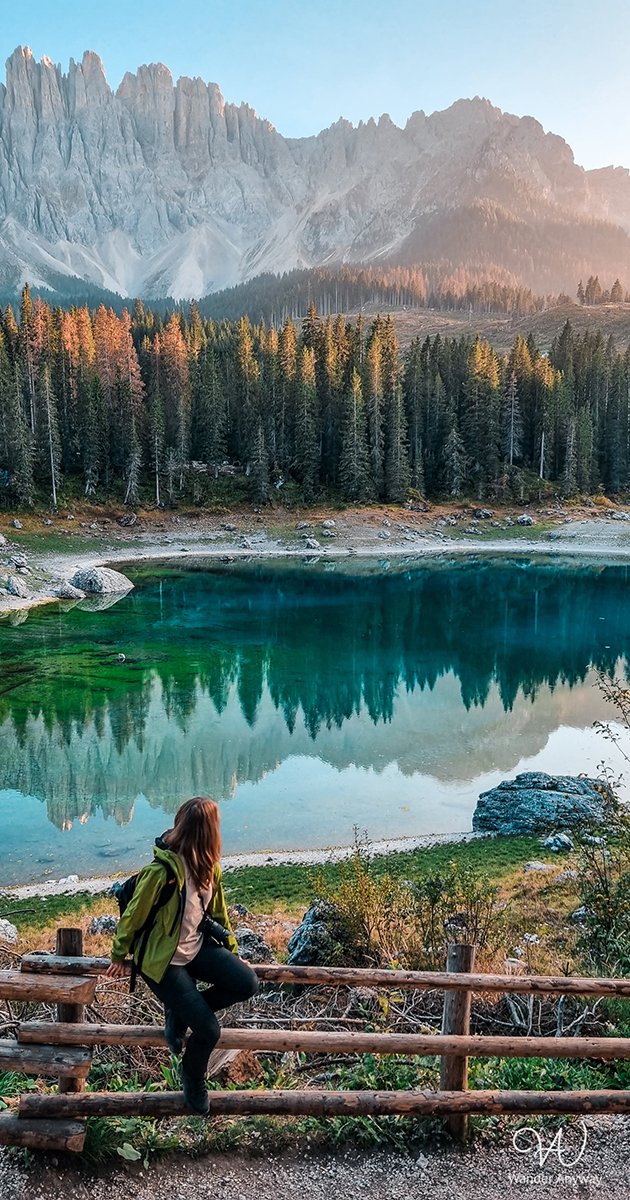Lake Carezza's pristine beauty amid the Dolomite mountain range.
