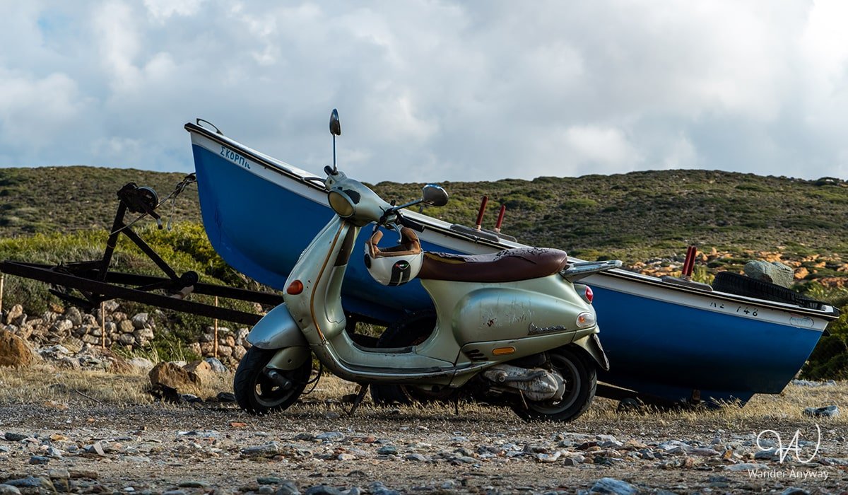 A boat and a scooter at Itanos Beach