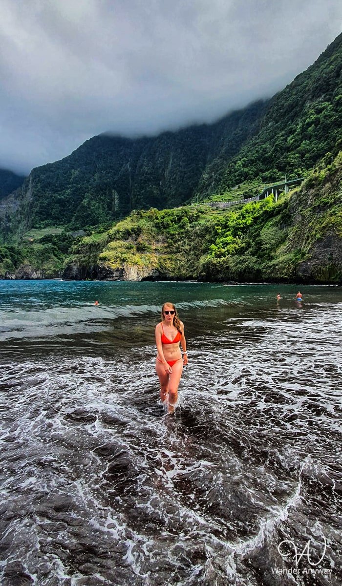 Black sand and ocean waves at Seixal Beach Madeira