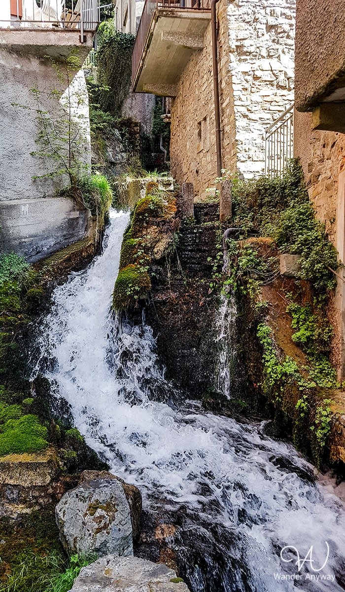 River/waterfall between the houses
