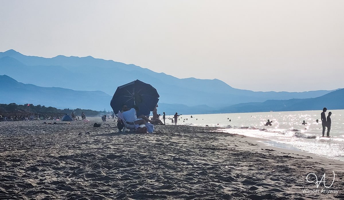 Episkopi Beach on Crete’s northern coast, offering wide sandy shores and shallow, clear waters.