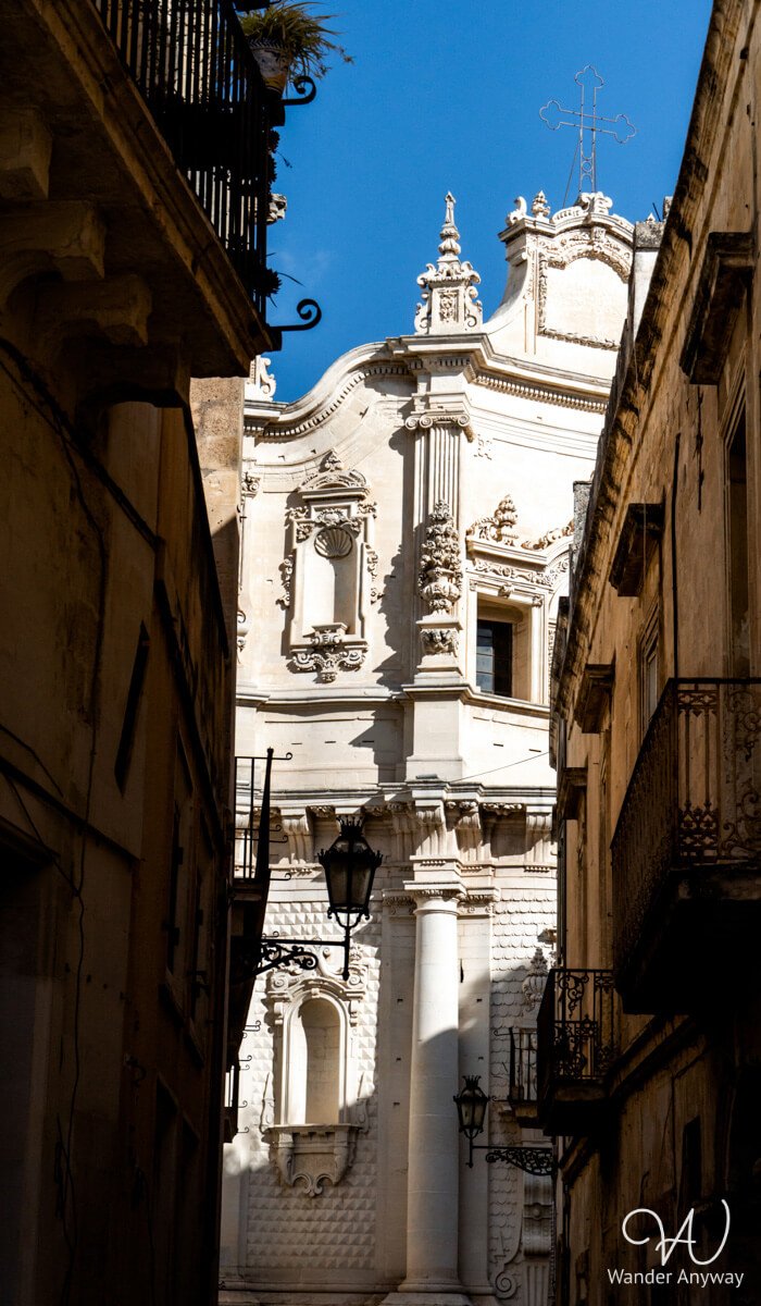 Chiesa di San Matteo in Lecce, featuring a distinctive curved facade and contrasting Baroque interior styles.