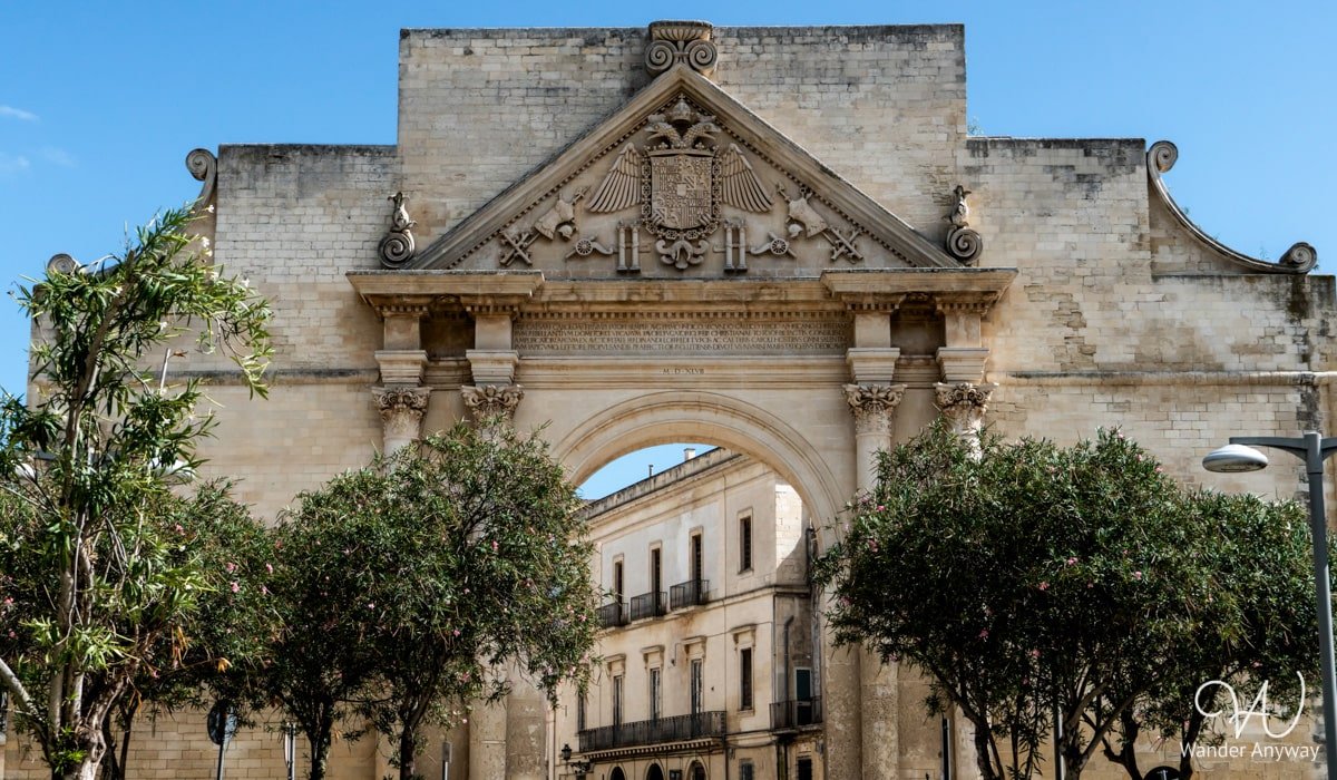 Porta Napoli, Lecce’s grand triumphal arch, built in honor of Emperor Charles V and marking the entrance to the historic center.