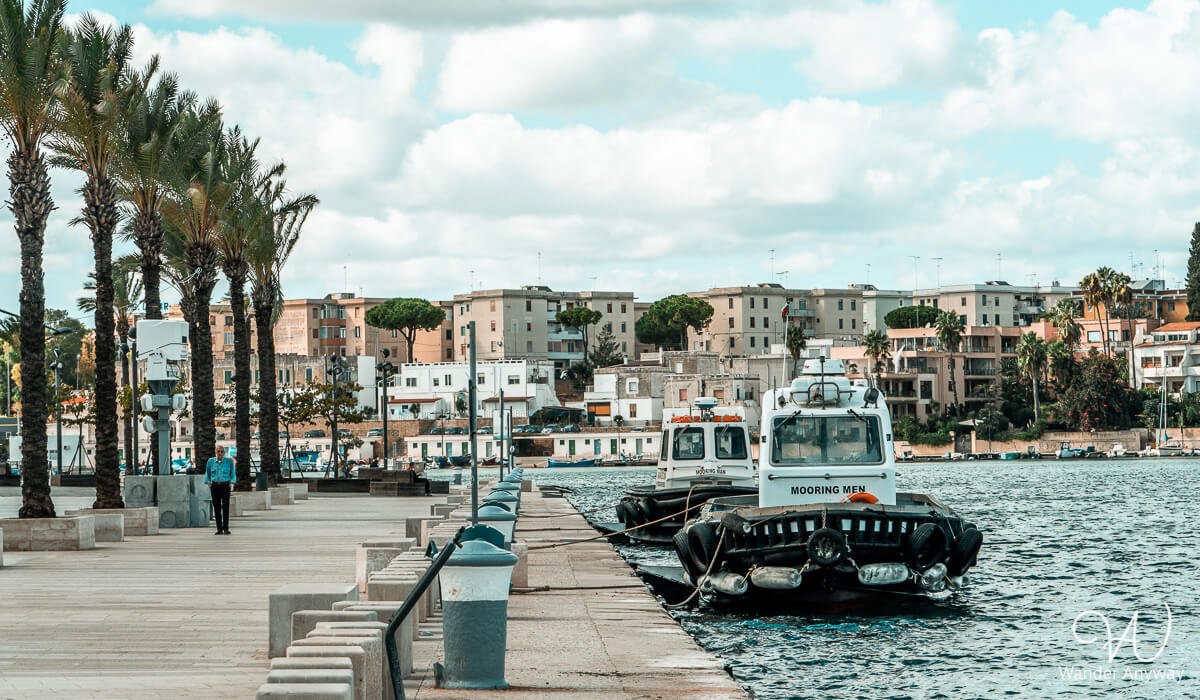 A scenic view of Brindisi’s Lungomare Regina Margherita, a beautiful waterfront promenade perfect for a seaside stroll on a day trip from Lecce by train.