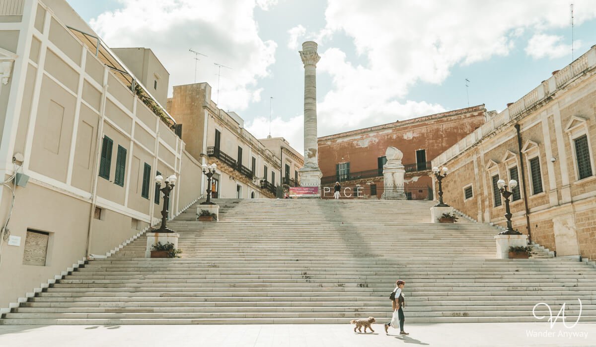 The ancient Roman columns in Brindisi, marking the historic end of the Appian Way—one of the highlights of a day trip from Lecce by train.