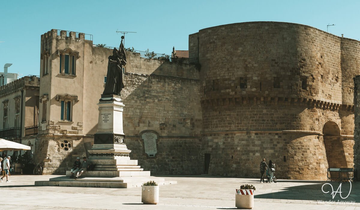 Historical landmarks in Otranto: the Martyrs' Monument and Alphonse Tower, reminders of the 1480 siege.