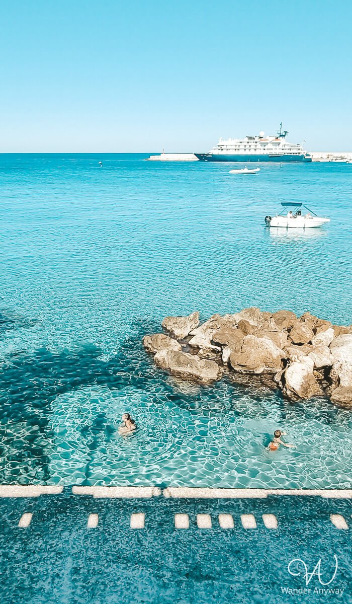 Crystal-clear waters and rocky shores at Spiaggia Bastioni, a great swimming spot in Otranto.