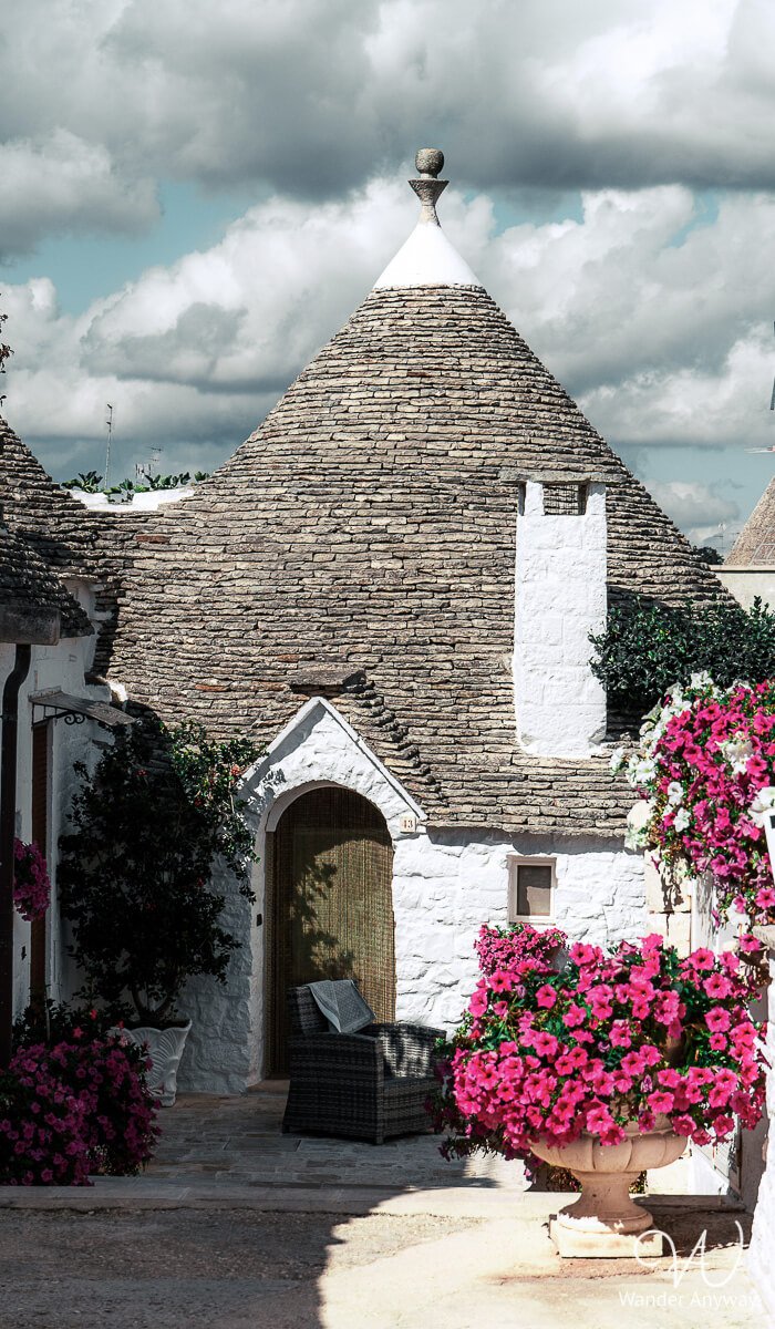 Alberobello street with traditional whitewashed trulli
