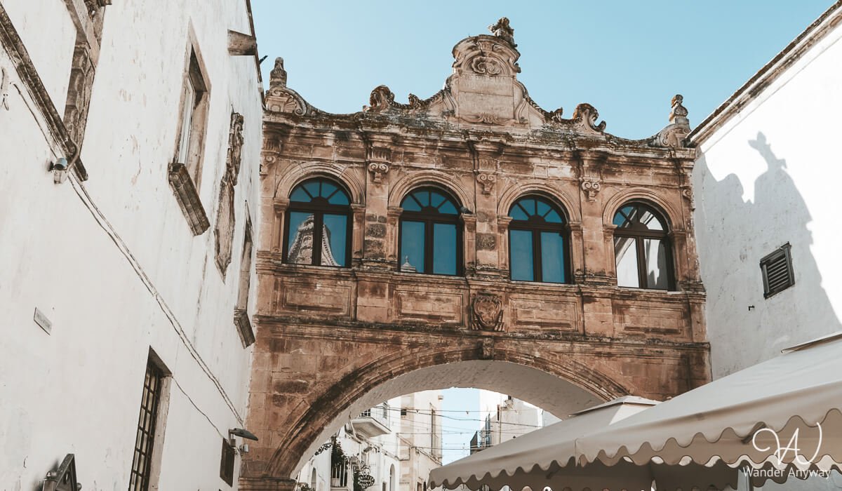 The historic Arco Scoppa arch connecting two buildings in Ostuni’s old town