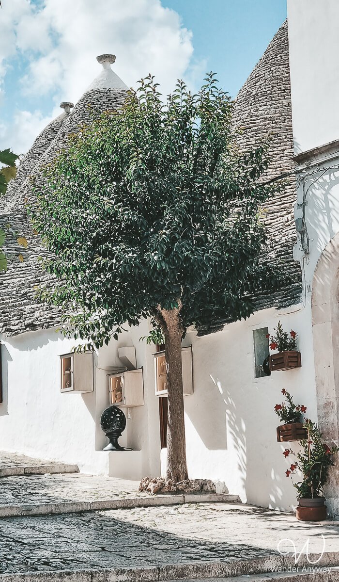 Stone staircase leading through a trulli district in Alberobello, Italy.