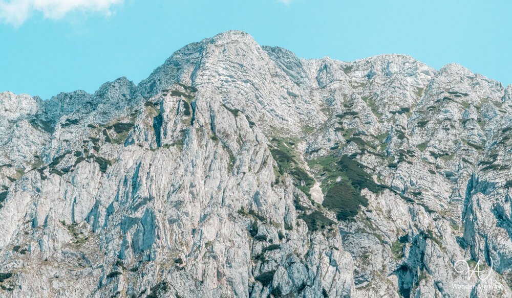 Craggy limestone walls of Piatra Craiului lit by afternoon light