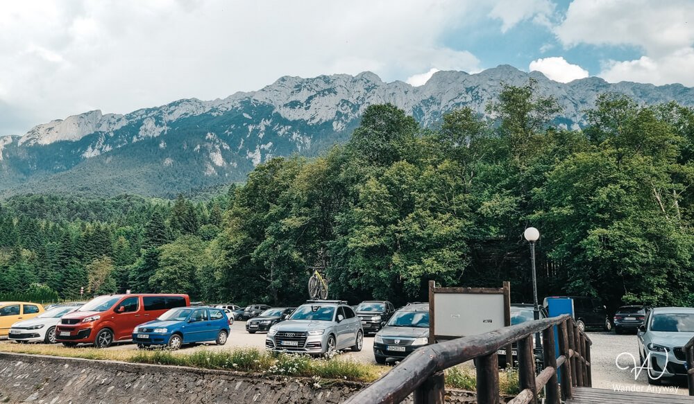 Plaiul Foii parking area with mountain ridge visible in the background